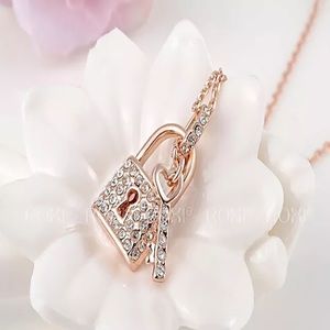 Rose gold love lock and key necklace by Diona J